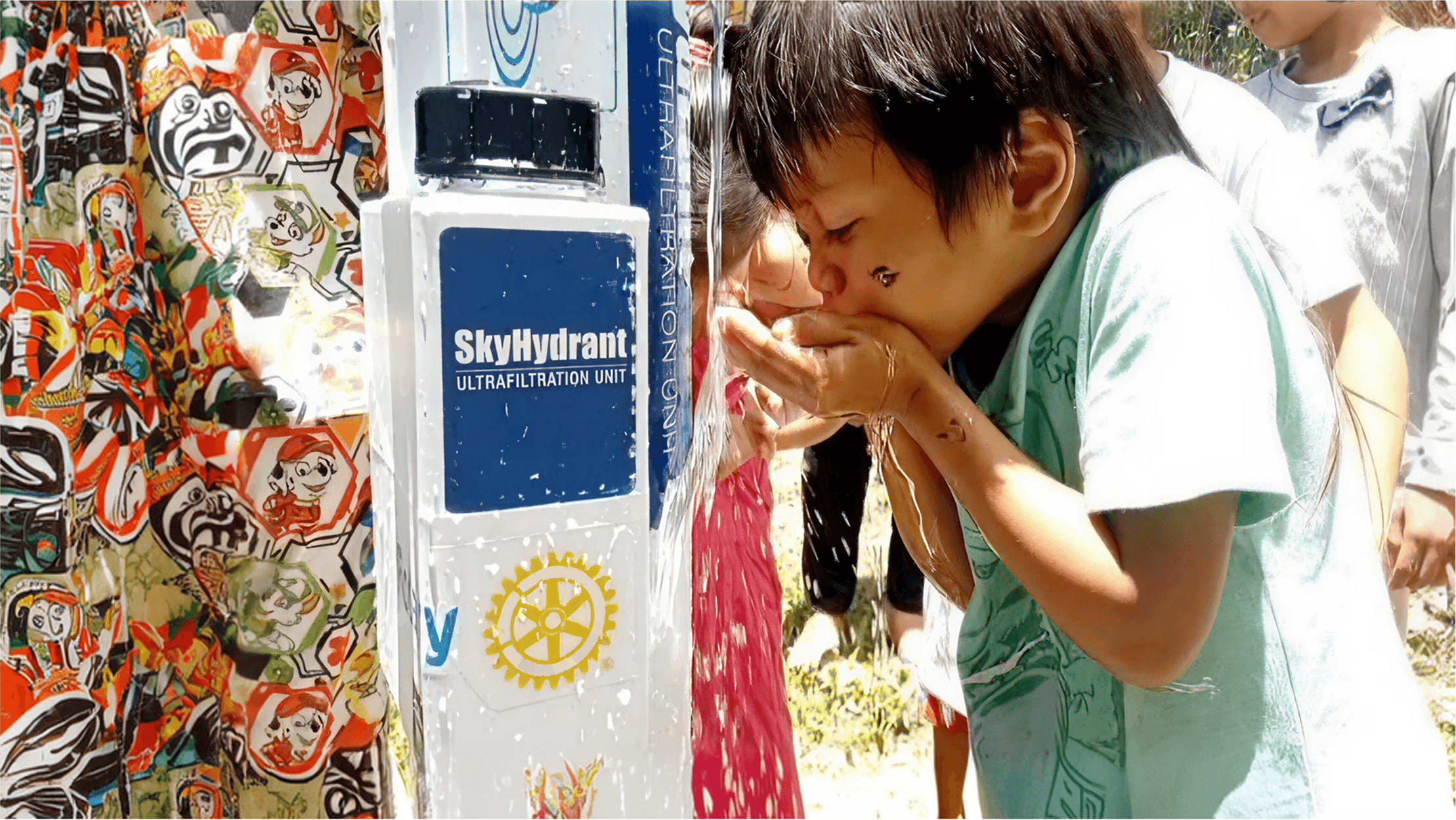 Filipino child receiving access to safe, clean water